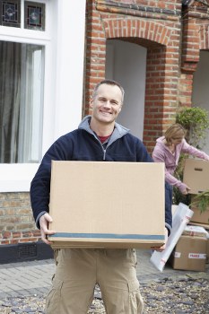 Furniture removal team managing a bulky item collection in a Tufnell Park street