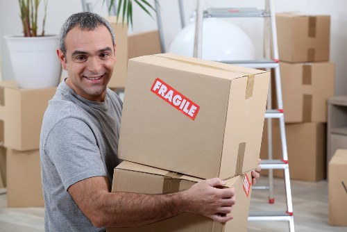 Removal van and moving boxes in a Tufnell Park street setting