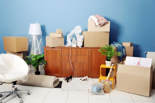 Packed boxes and furniture ready for home relocation