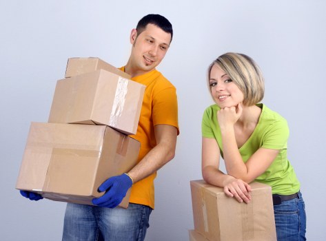 Moving team loading office furniture in North London