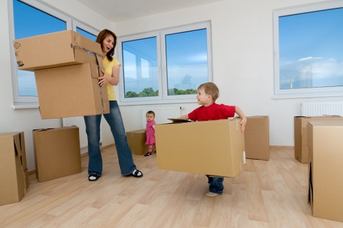 Local movers handling boxes in a Tufnell Park residential street