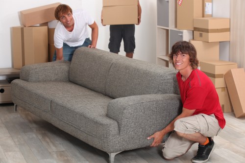 Moving team handling boxes near a residential street in Tufnell Park