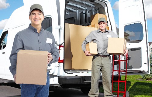 Packed boxes and protected furniture ready for a house move